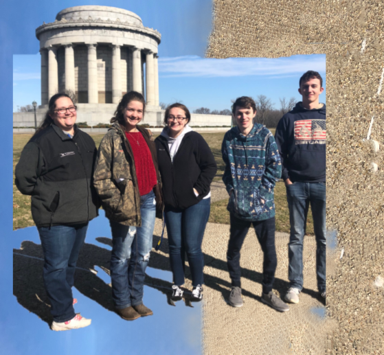 A group of students standing in front of the George Rogers Clark Memorial