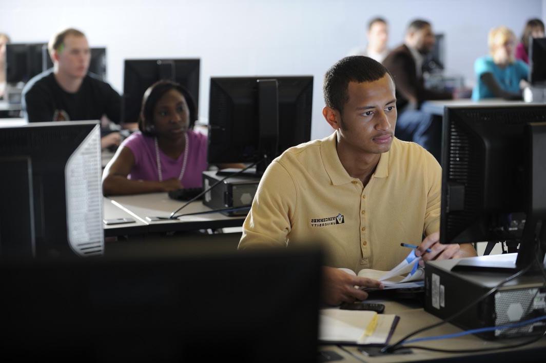 writing guy at computer